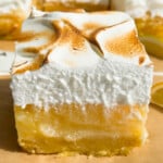 Sliced lemon bar with toasted meringue.