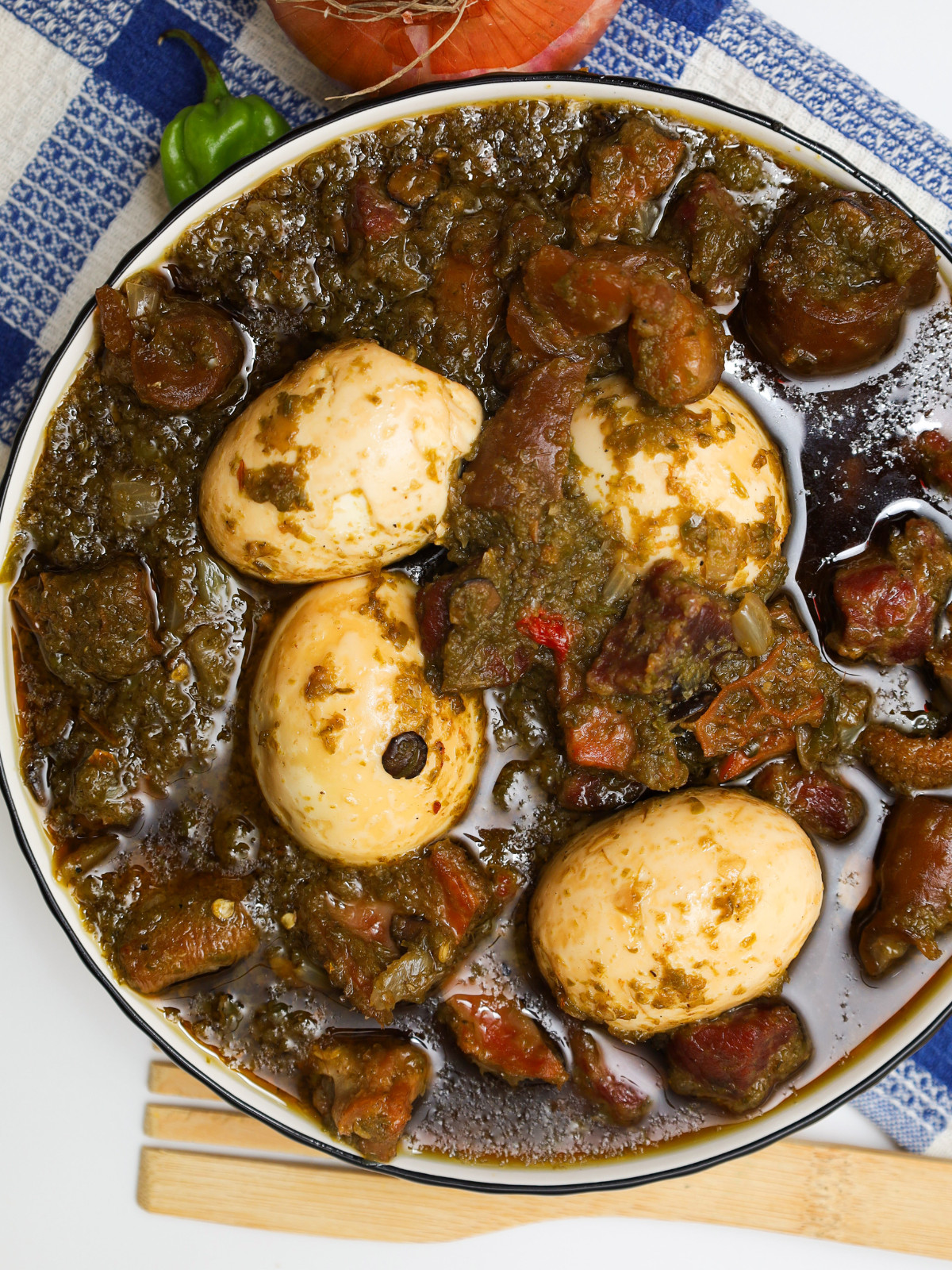 Aya mase in a bowl with boiled eggs.