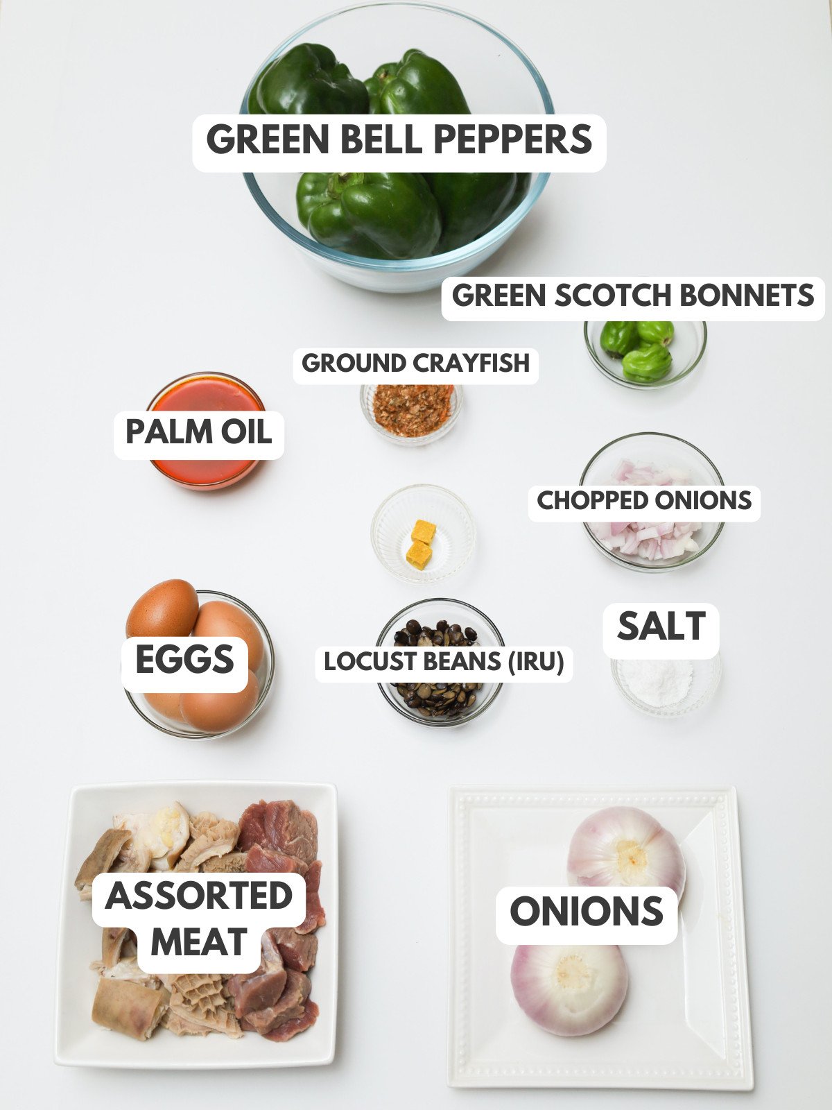 Green bell peppers, scotch bonnets, ground crayfish, palm oil, eggs, onioins, iru, and assorted meat.