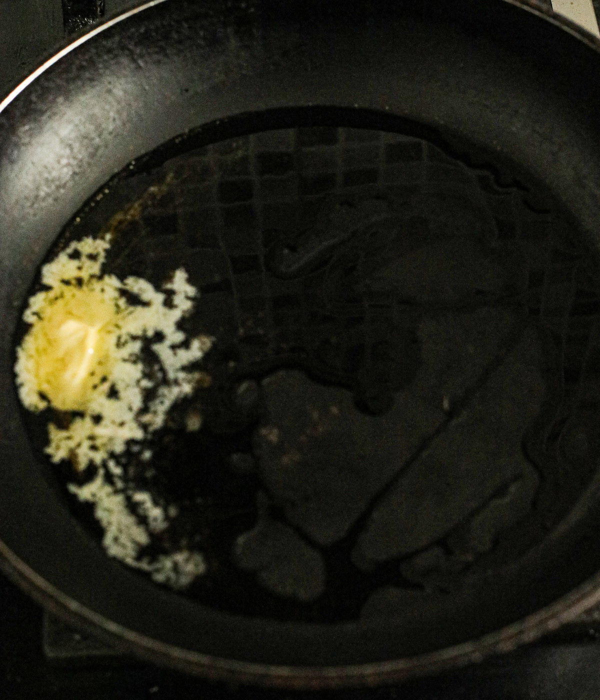 Oil and butter heated in a black pan.