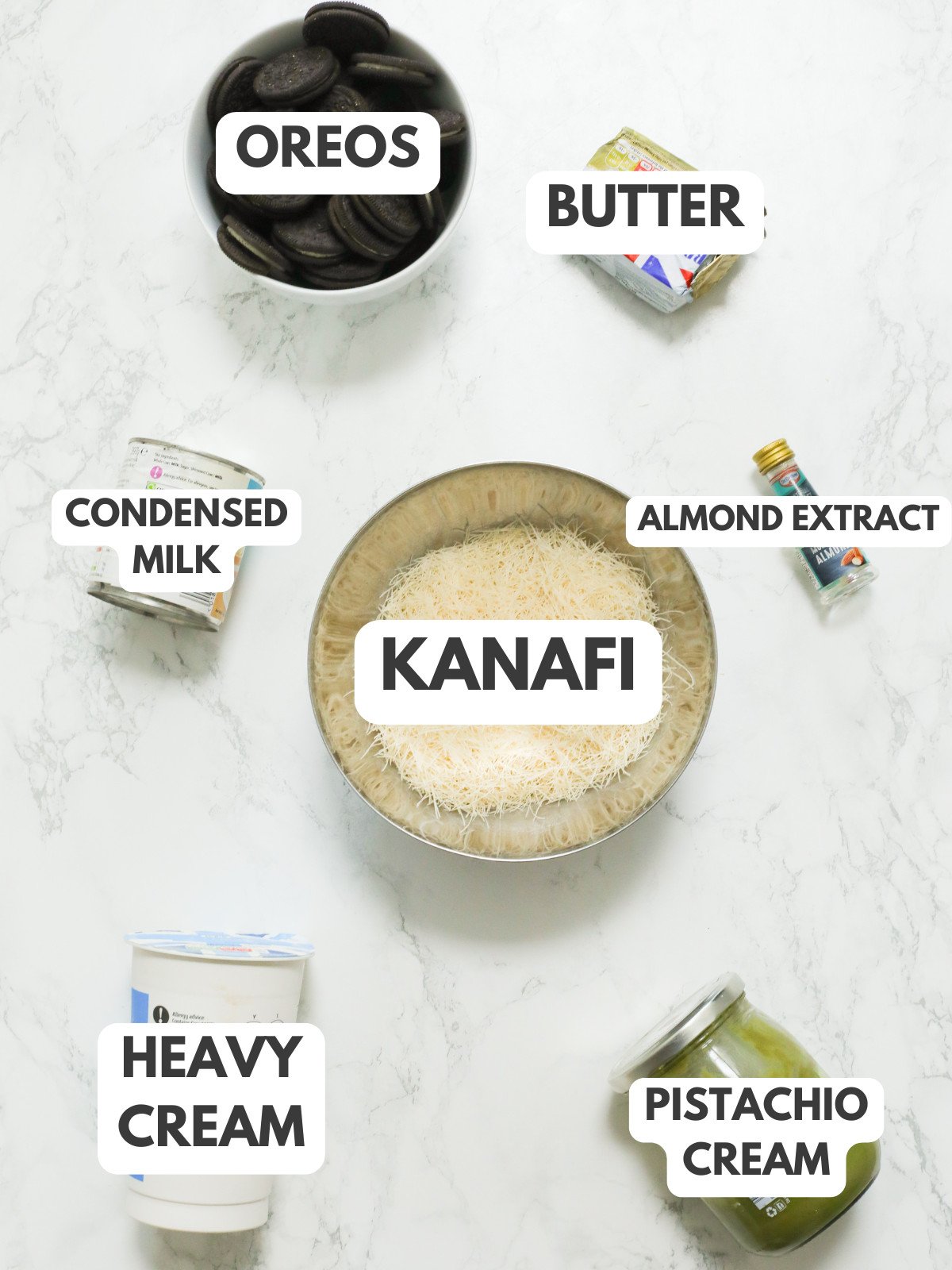 Oreos, butter, condensed milk, kanafi, almond extract, heavy cream, and pistachio cream.