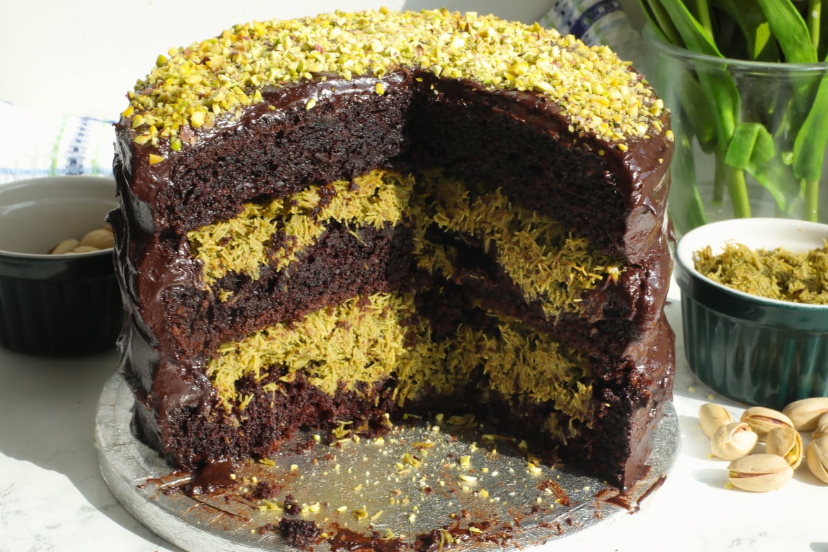 The inside of a three layer Dubai cake filled with pistachio kanafi.