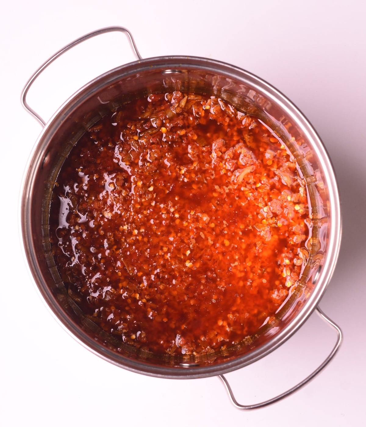Cooked agoyin sauce in a silver pot.