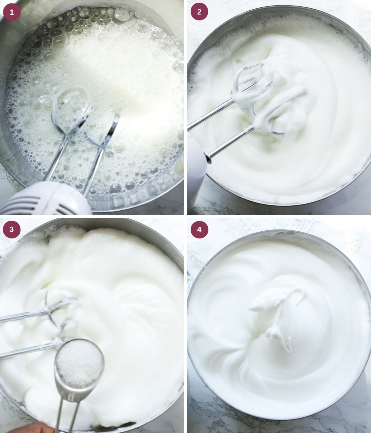 Egg whites whisked to stiff peaks in a silver bowl with sugar.