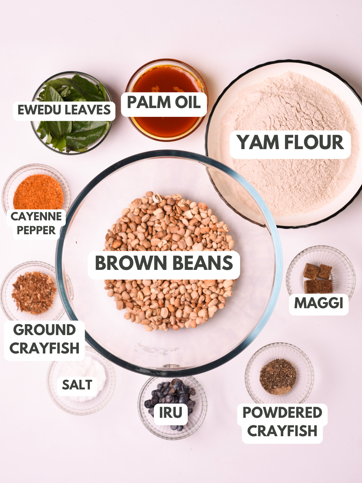 Ewedu leaves, palm oil, yam flour, brown beans, maggi, cayenne pepper, crayfish, iru and salt.