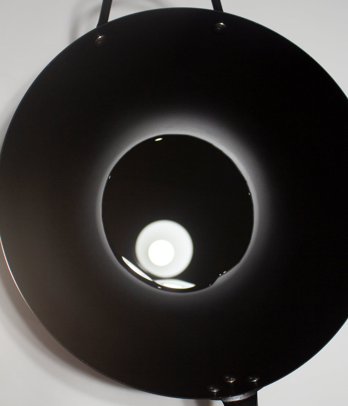 Hot oil in a black pan.