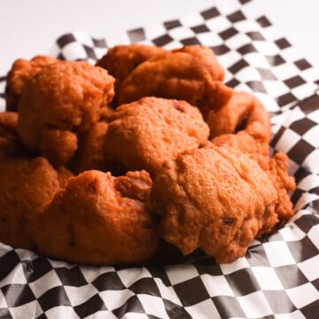 African bean fritters in a checkered plate.