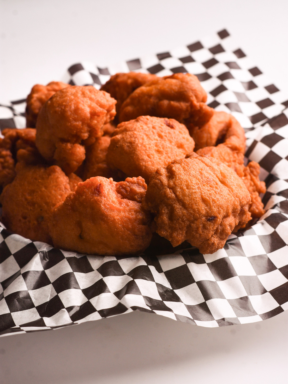 Nigerian bean fritters in a checkered plate.