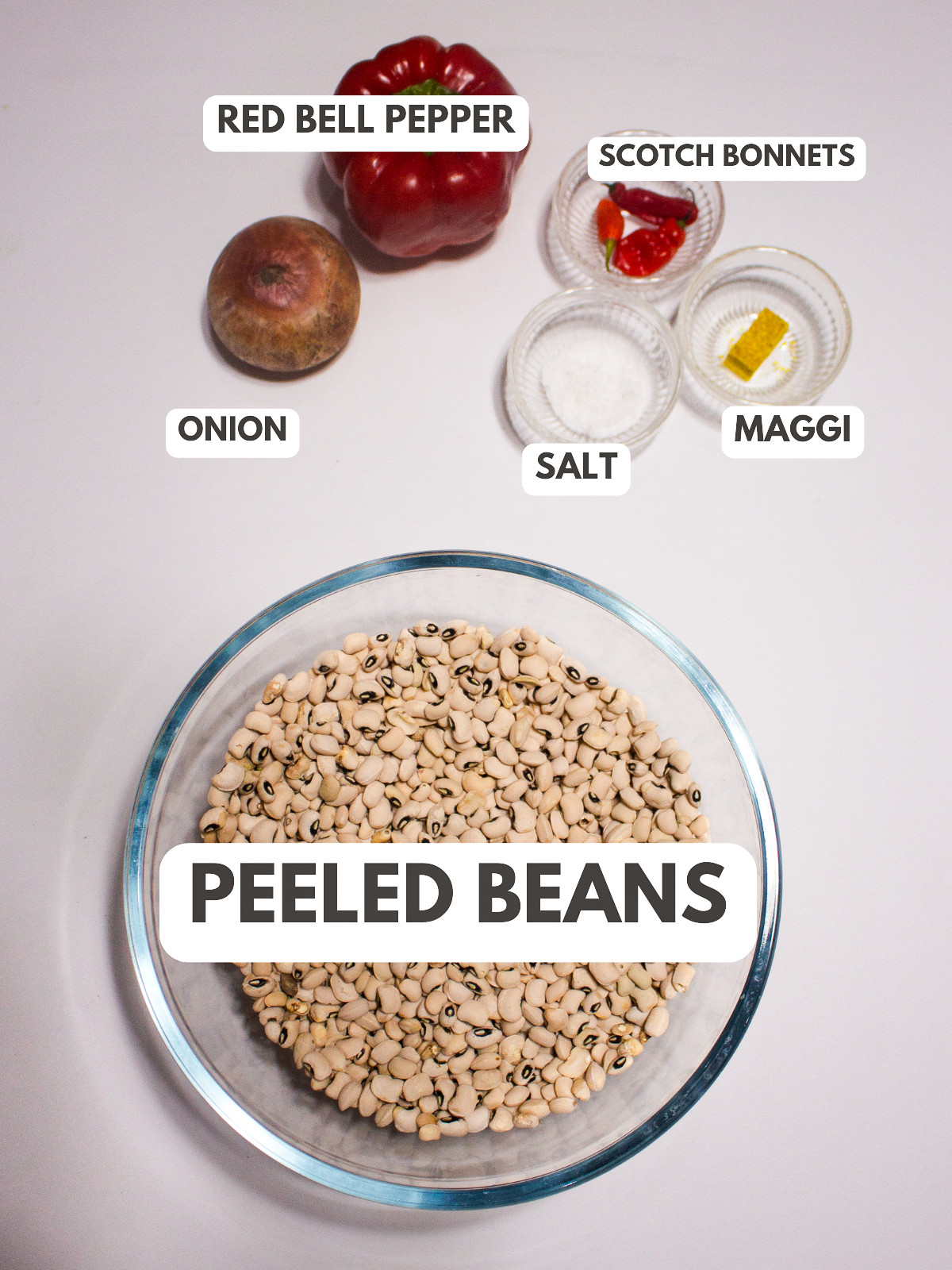 Red bell pepper, onion, scotch bonnet, salt, maggi and peeled beans.