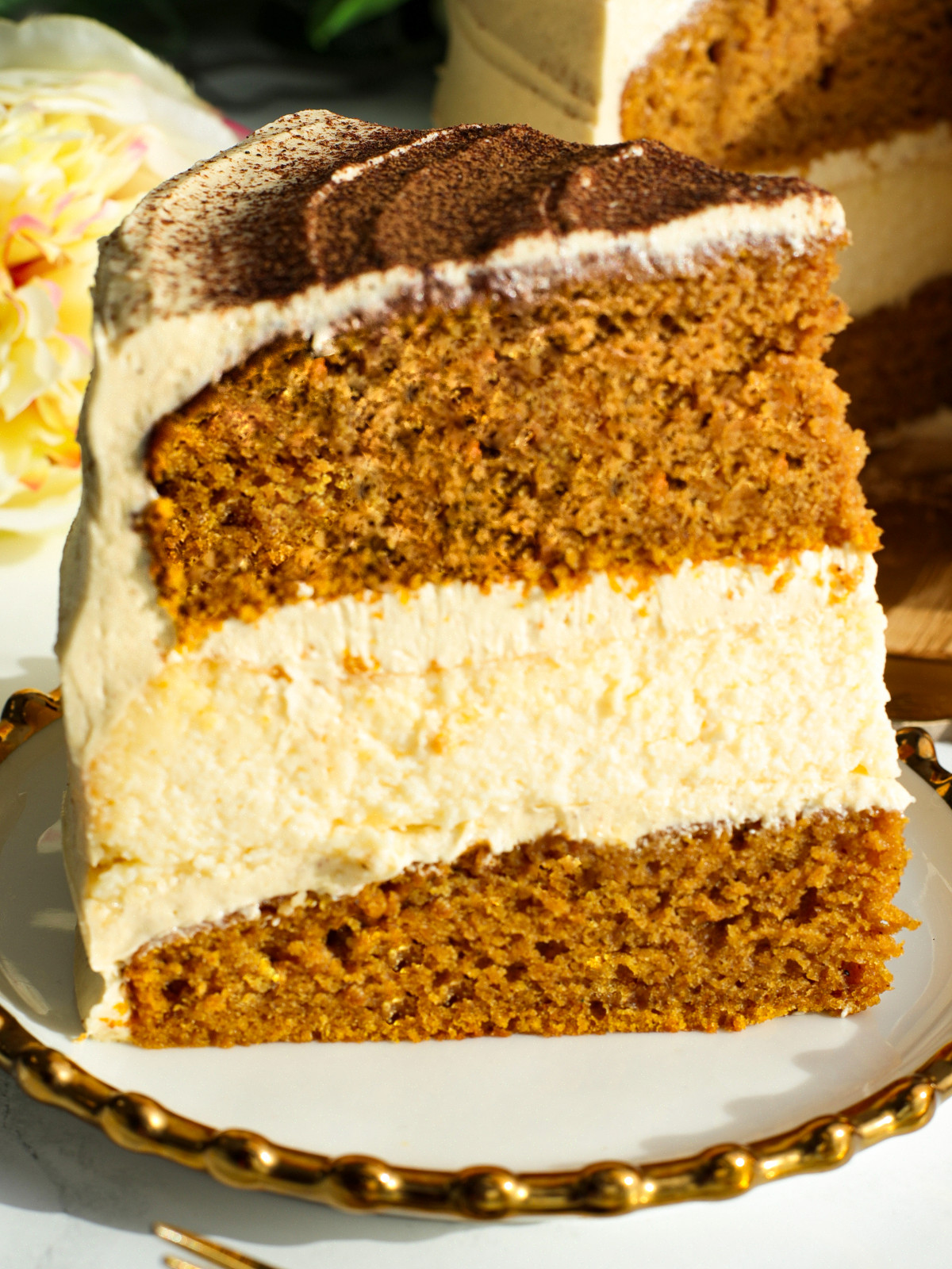 A slice of pumpkin cheese cake cake on a plate.