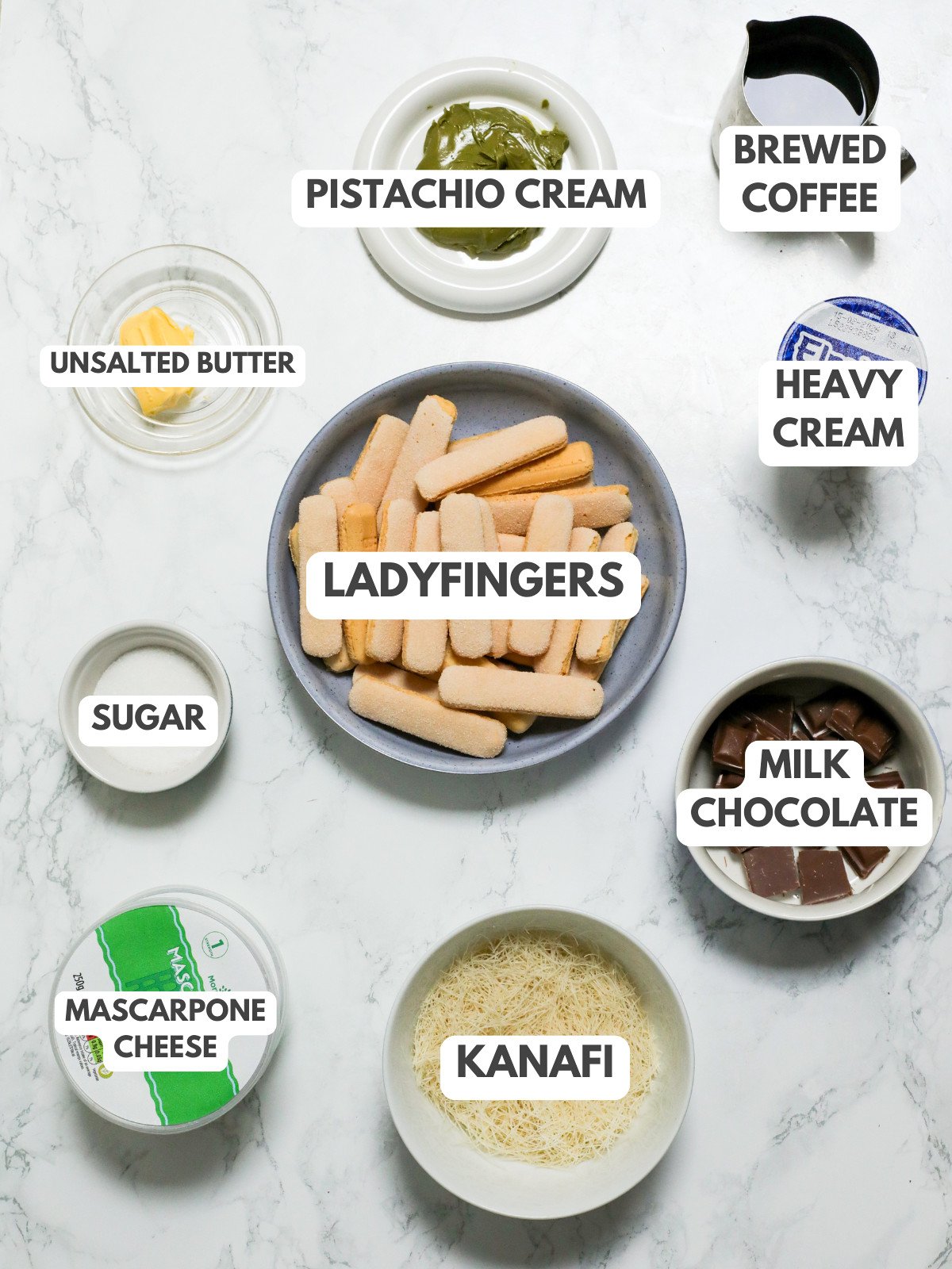 Unsalted butter, pistachio cream, coffee, ladyfingers, cream, kanafi, mascarpone, milk chocolate and sugar.