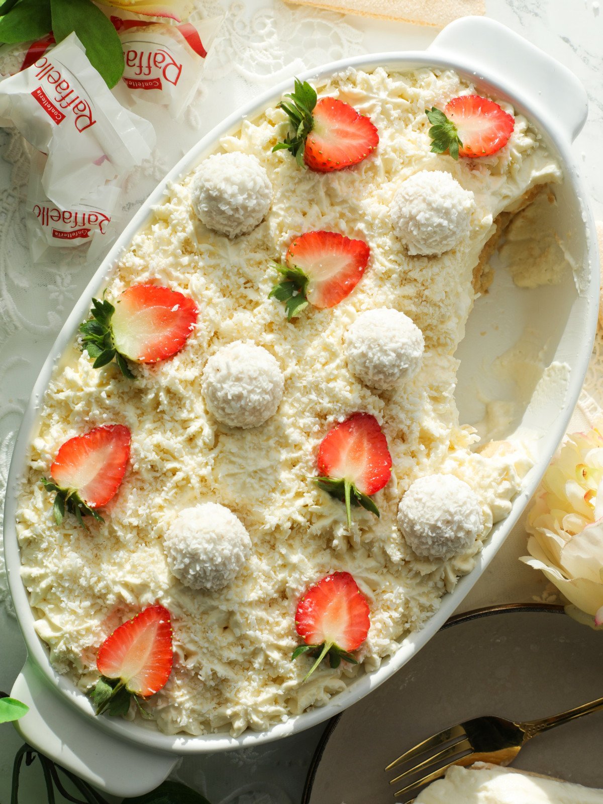 Coconut Raffaellos Tiramisu in a white oval dish.