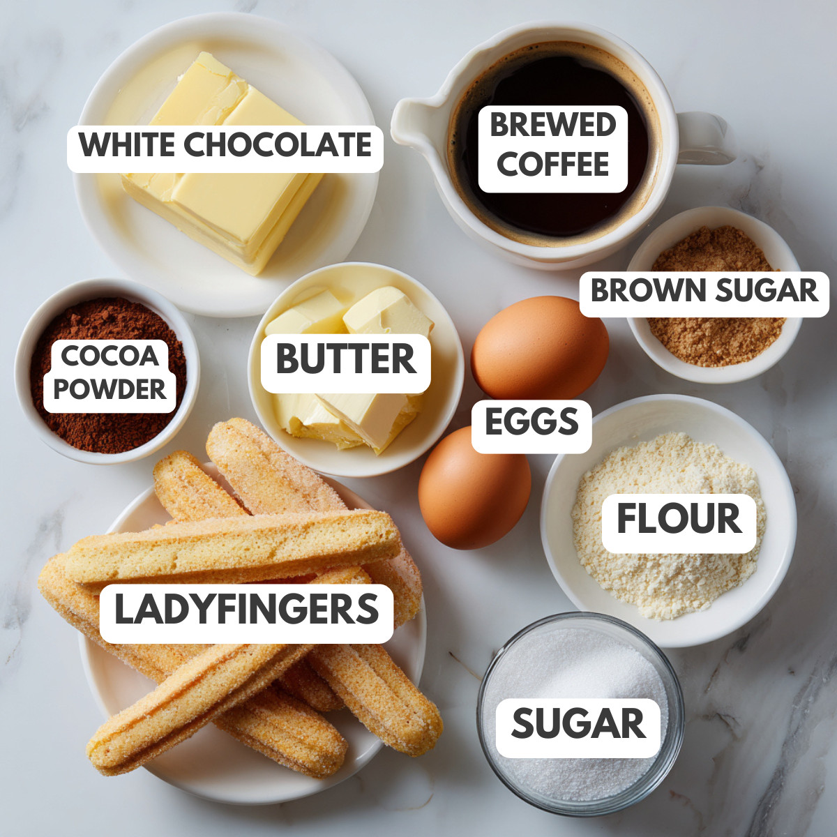 White chocolate, brewed coffee, eggs, butter, sugar, ladyfingers and cocoa.