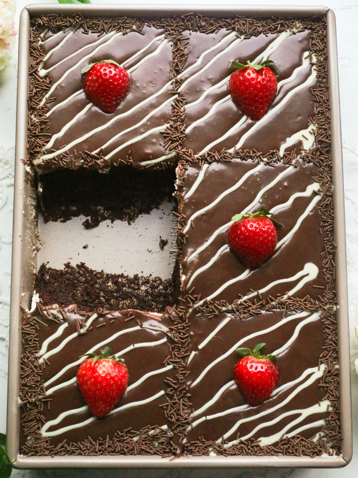 Chocolate cake with mascarpone cream, chocolate ganache and strawberries.