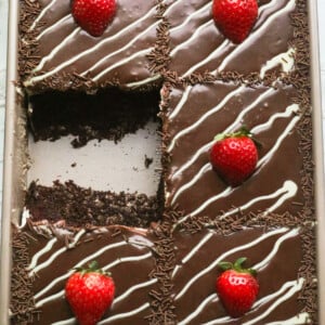 Chocolate cake with mascarpone cream, milk chocolate ganache and strawberries.