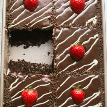 Chocolate cake with mascarpone cream, milk chocolate ganache and strawberries.