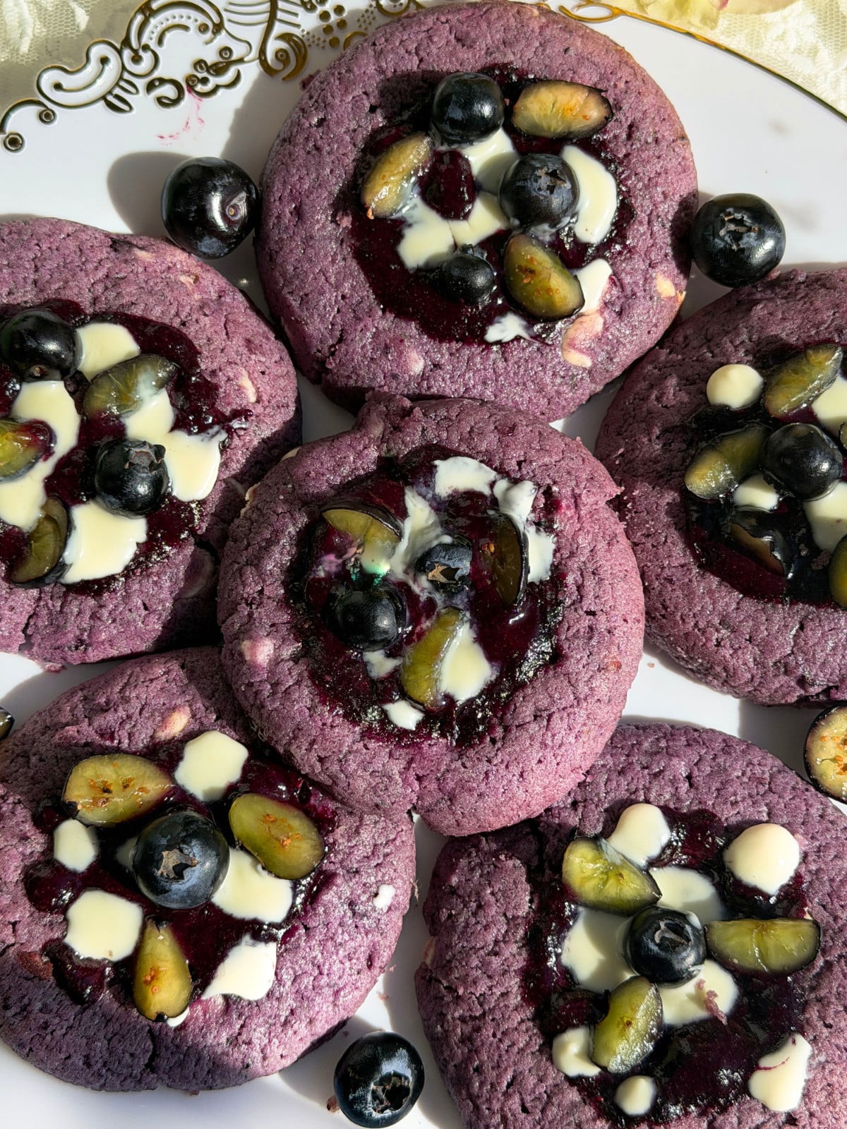 Blueberries and white chocolate chip cookies.