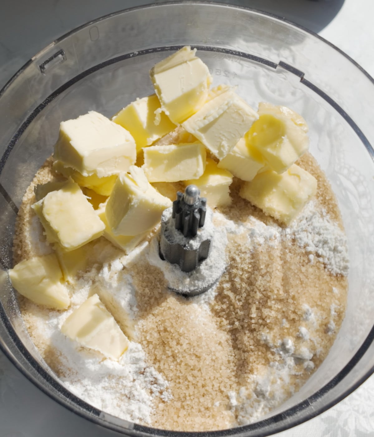 Butter, flour and sugar in a food processor.