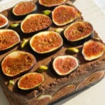 Fig chocolate mousse on a beige board.