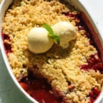 Plums crumble inn a white dish.