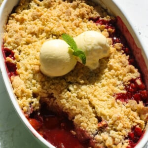 Plums crumble inn a white dish.