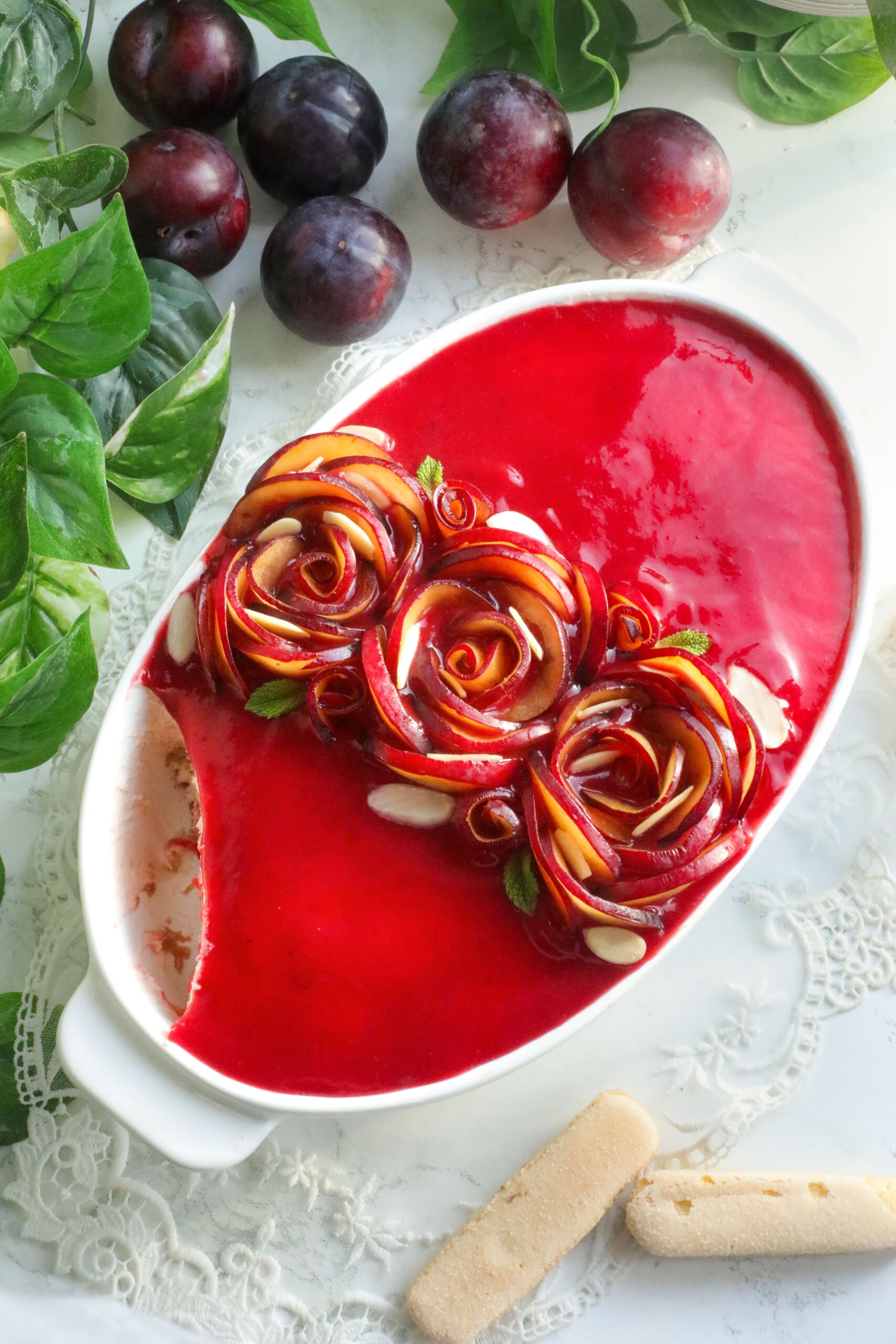 Plums tiramisu in a white dish.